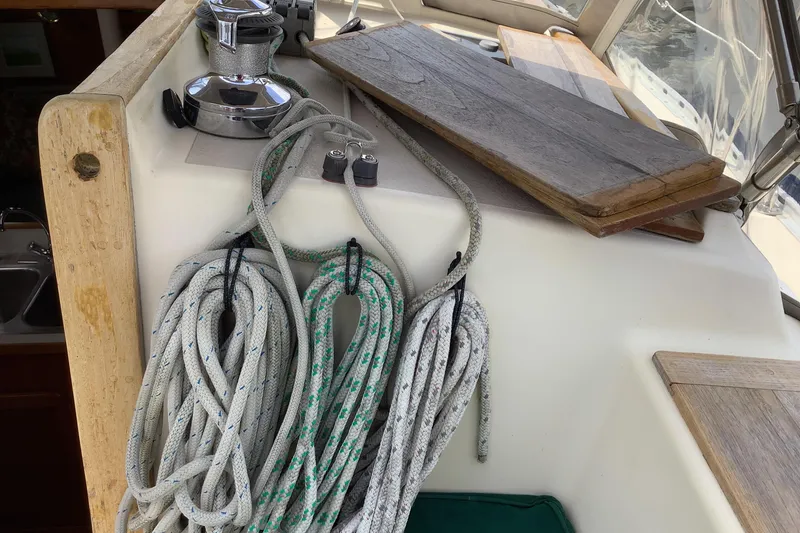 Slide: The Image of Coiled ropes and winch on 1994 Caliber Cutter Rig sailboat deck. - 17