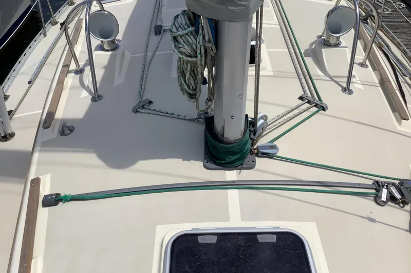 Slide: The Image of Deck of 1994 Caliber Cutter Rig sailboat with ropes and fittings. - 18