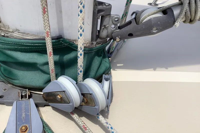 Slide: The Image of Close-up of 1994 Caliber Cutter Rig sailboat rigging and pulleys. - 21