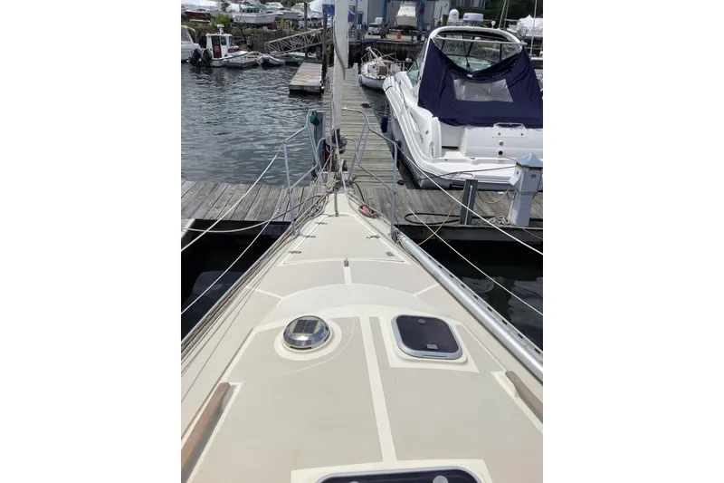 Slide: The Image of 1994 Caliber Cutter Rig sailboat docked at marina, view from deck. - 22