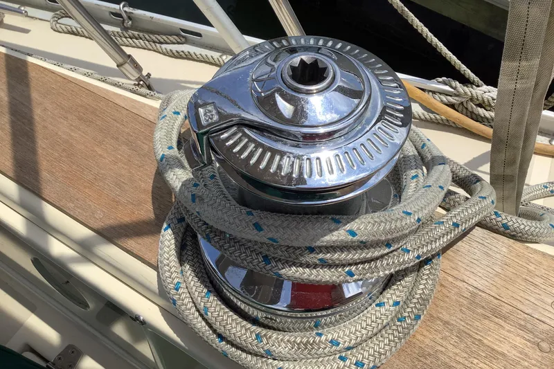 Slide: The Image of Chrome winch with rope on 1994 Caliber Cutter Rig sailboat deck. - 24