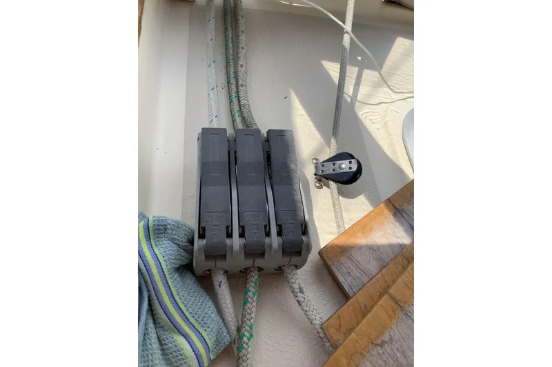 Slide: The Image of Rope clutches and pulley on 1994 Caliber Cutter Rig sailboat deck. - 26