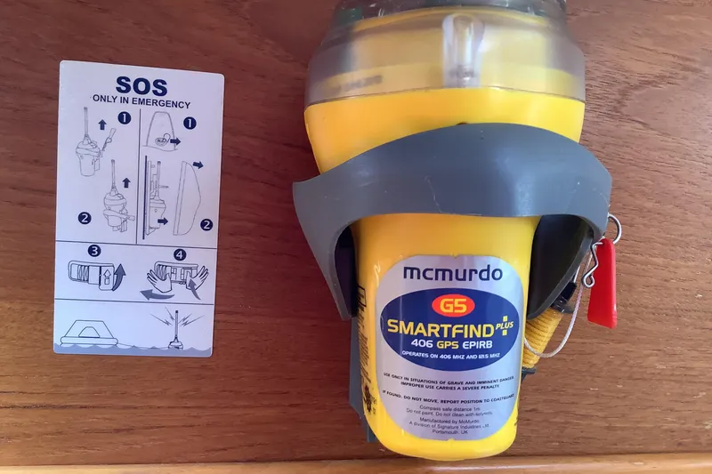 Slide: The Image of McMurdo G5 SmartFind Plus EPIRB with emergency instructions, on a 1994 Caliber Cutter Rig. - 28
