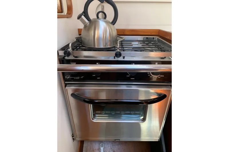 Slide: The Image of Stainless steel stove with kettle on a 1994 Caliber Cutter Rig yacht. - 34