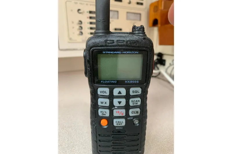 Slide: The Image of Handheld Standard Horizon HX850S marine radio on a 1994 Caliber Cutter Rig. - 49