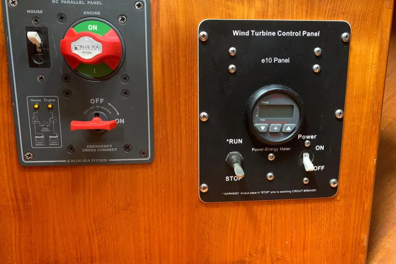 Slide: The Image of Control panels on a 1994 Caliber Cutter Rig, featuring wind turbine and power management systems. - 50