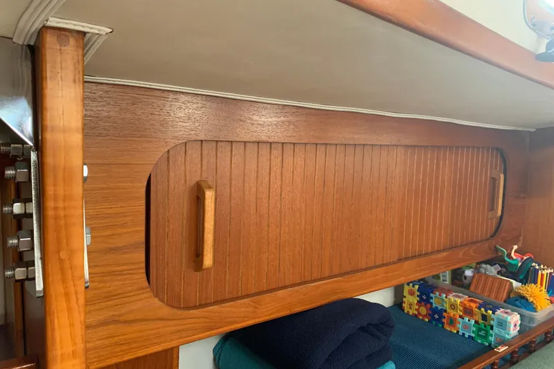 Slide: The Image of Wooden interior cabinet on a 1994 Caliber Cutter Rig. - 54