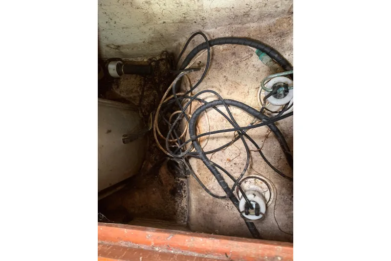 Slide: The Image of Tangled cables in the bilge of a 1994 Caliber Cutter Rig sailboat. - 72