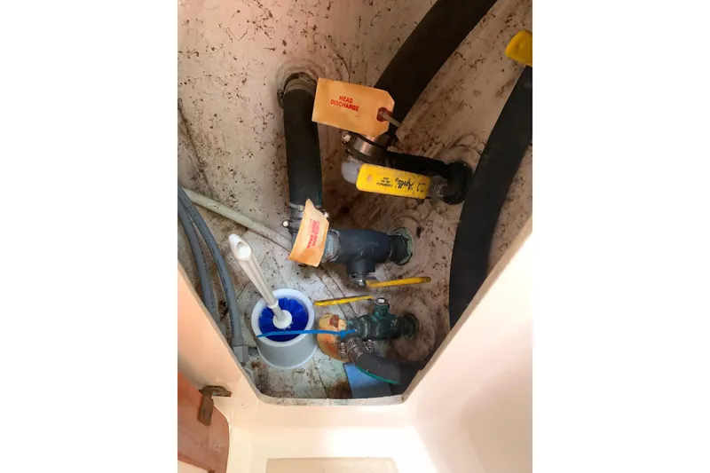 Slide: The Image of Boat plumbing system with labeled valves, Caliber Cutter Rig 1994. - 74