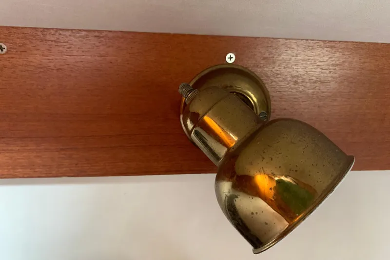 Slide: The Image of Brass light fixture on wooden panel, Caliber Cutter Rig - 76