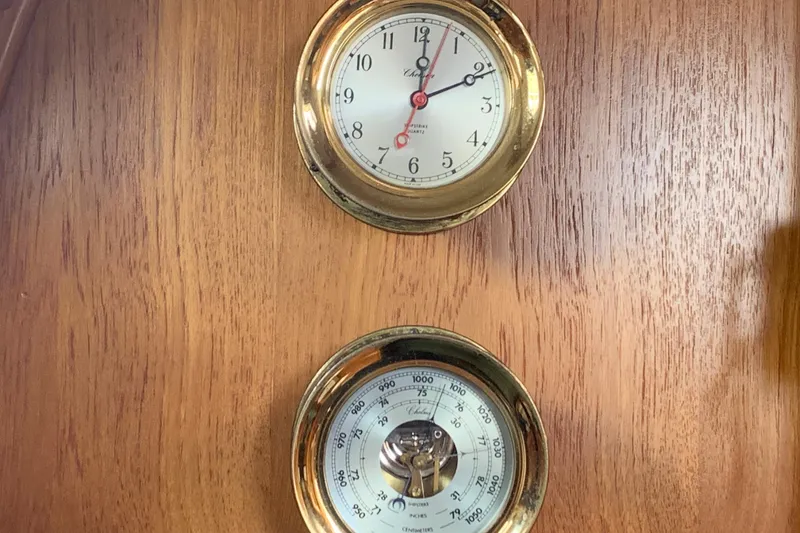 Slide: The Image of Brass clock and barometer on wooden panel, Caliber Cutter Rig 1994. - 77