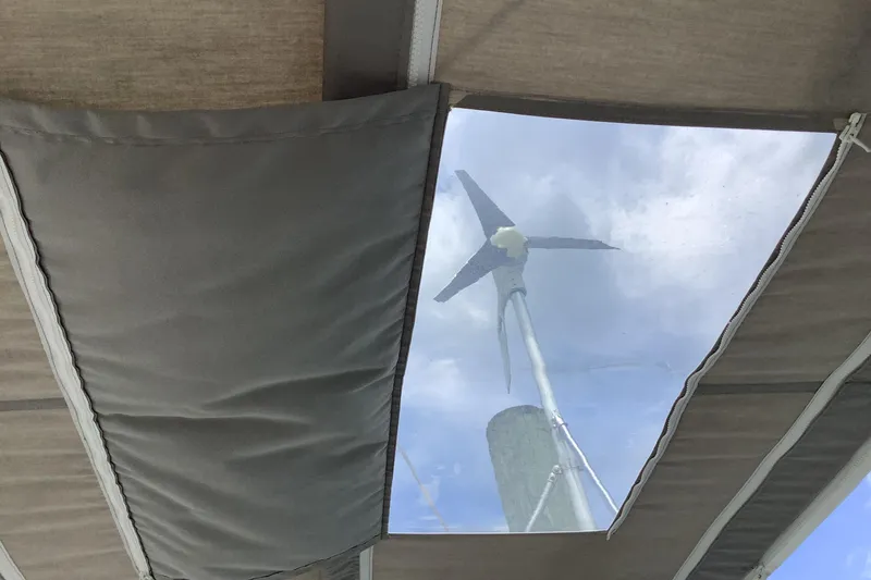 Slide: The Image of View of wind turbine through Caliber Cutter Rig's canopy window, 1994 model. - 8