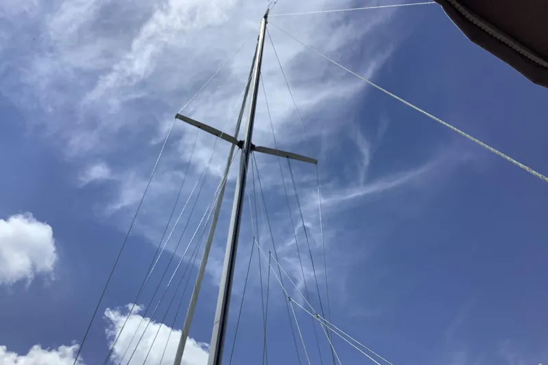 Slide: The Image of Mast of 1994 Caliber Cutter Rig sailboat against a clear blue sky. - 9