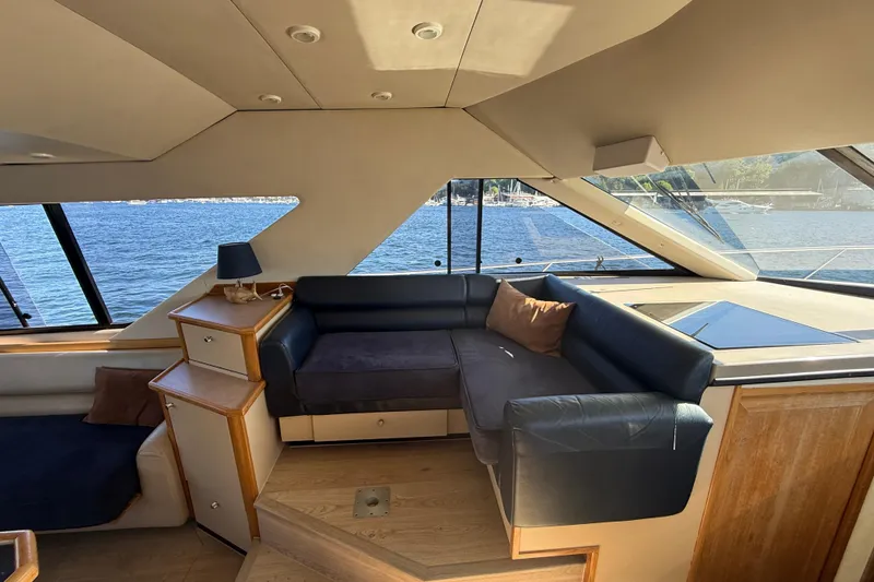 Slide: The Image of Luxurious interior of 1997 Bayliner 3988 Command Bridge Motoryacht with waterfront view. - 21