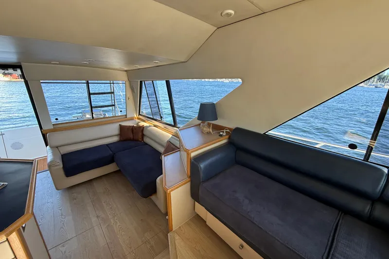 Slide: The Image of Interior of 1997 Bayliner 3988 Command Bridge Motoryacht with waterfront view. - 22