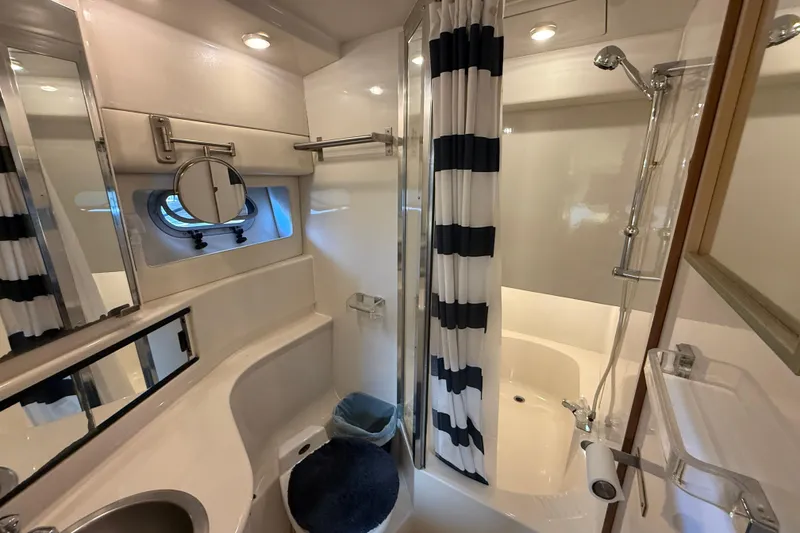 Slide: The Image of Bathroom of 1997 Bayliner 3988 Command Bridge Motoryacht with shower and striped curtain. - 28