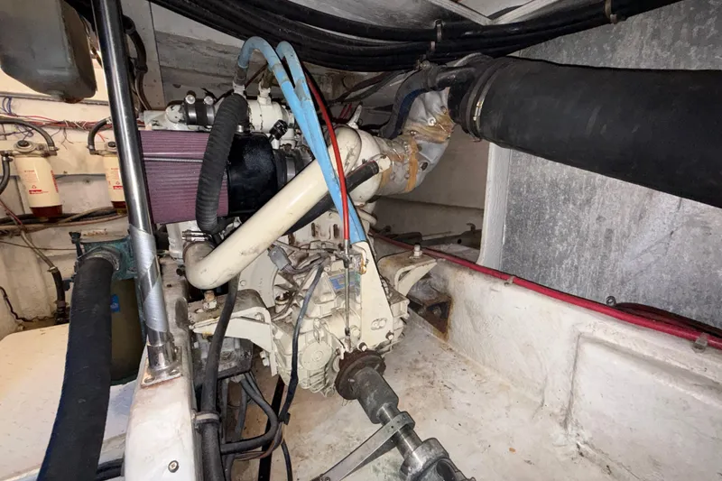 Slide: The Image of Engine room of a 1997 Bayliner 3988 Command Bridge Motoryacht, showcasing mechanical components. - 36