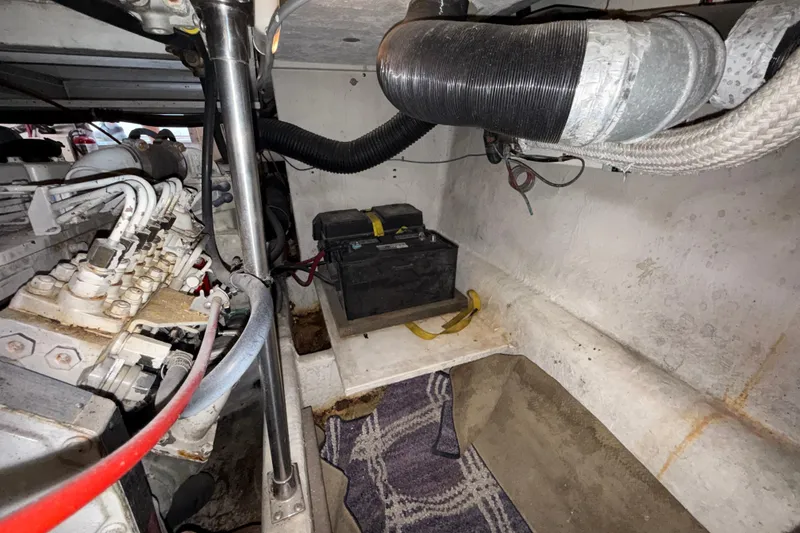 Slide: The Image of Engine room of 1997 Bayliner 3988 Command Bridge Motoryacht with battery and mechanical components. - 39