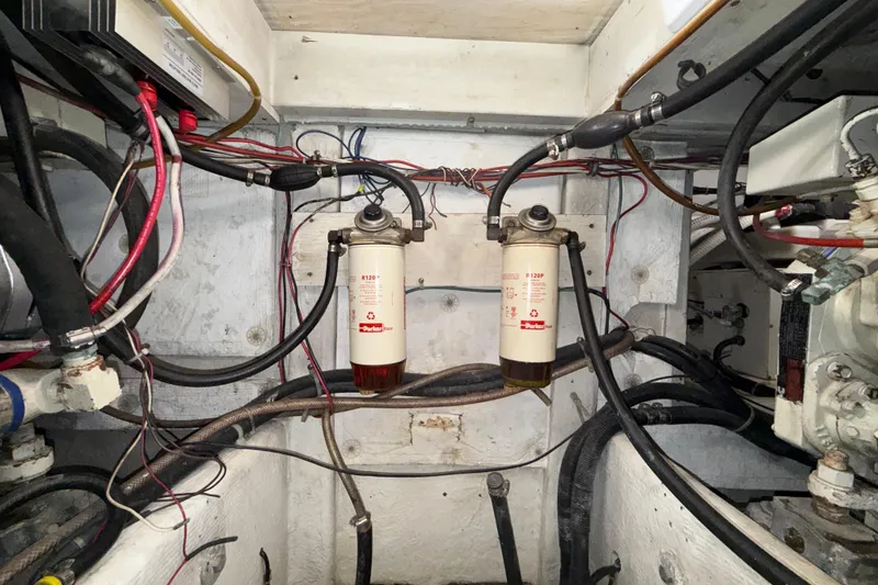 Slide: The Image of Engine room of 1997 Bayliner 3988 Command Bridge Motoryacht with fuel filters and wiring. - 41
