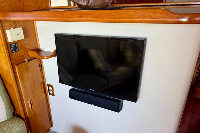 Slide: The Image of 1958 Blanchard Pilothouse interior with mounted TV and soundbar. - 22
