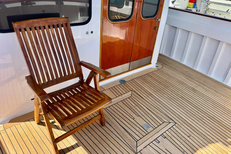 Slide: The Image of Wooden deck and chair on a 1958 Blanchard Pilothouse boat. - 13