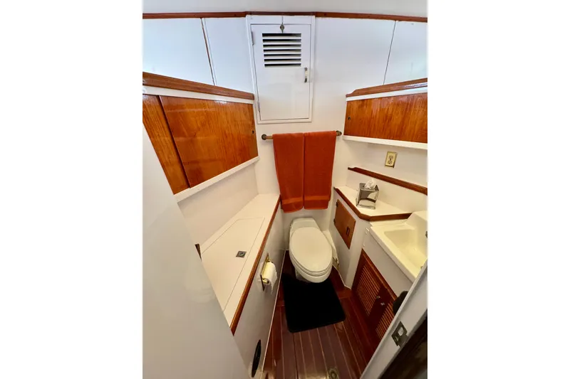 Slide: The Image of 1958 Blanchard Pilothouse bathroom with wooden cabinetry and modern fixtures. - 29