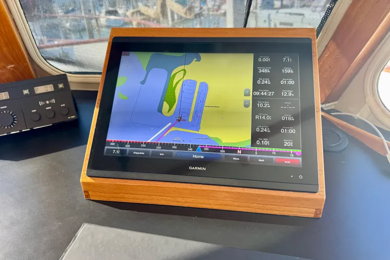 Slide: The Image of Pilothouse navigation system on a 1958 Blanchard boat, featuring a Garmin display. - 40