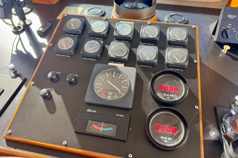 Slide: The Image of 1958 Blanchard Pilothouse control panel with gauges and RPM meters. - 43