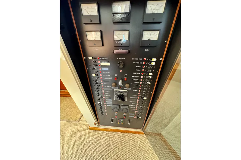 Slide: The Image of 1958 Blanchard Pilothouse control panel with gauges and switches. - 44