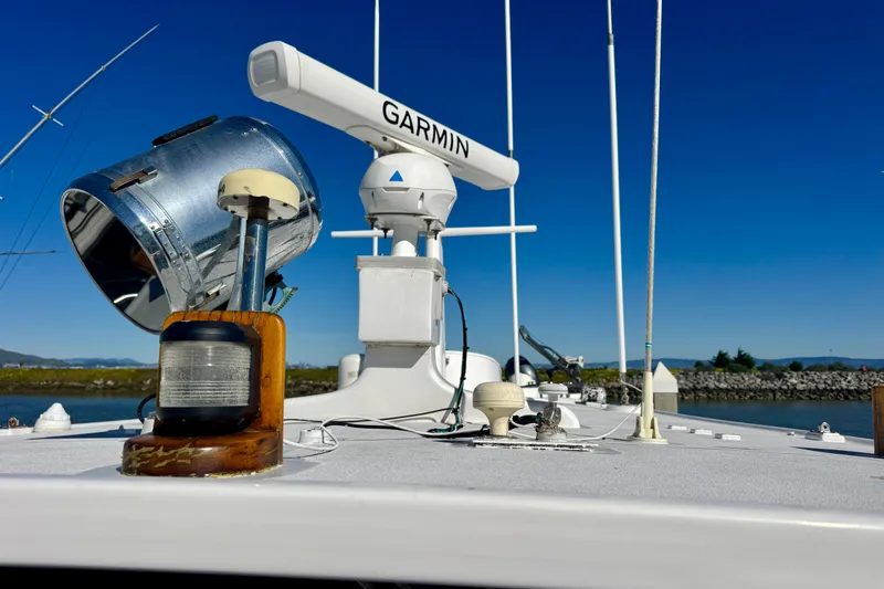 Slide: The Image of 1958 Blanchard Pilothouse boat deck with Garmin radar and vintage spotlight. - 46
