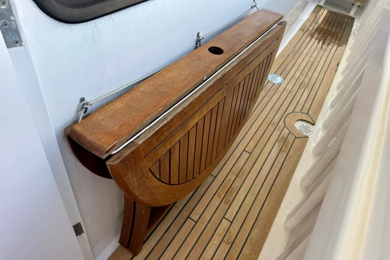 Slide: The Image of 1958 Blanchard Pilothouse boat with wooden foldable table on deck. - 14