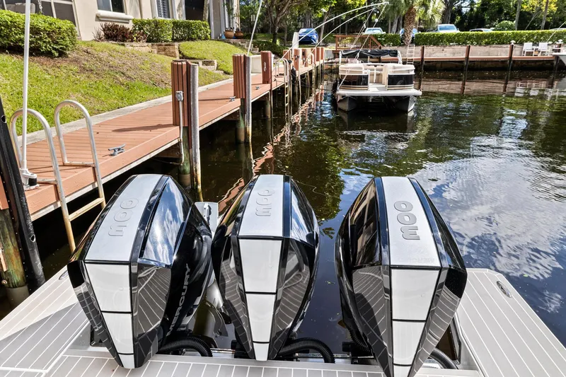 Slide: The Image of 2021 Formula 380 Super Sport Crossover OB with triple outboard engines at dock. - 17