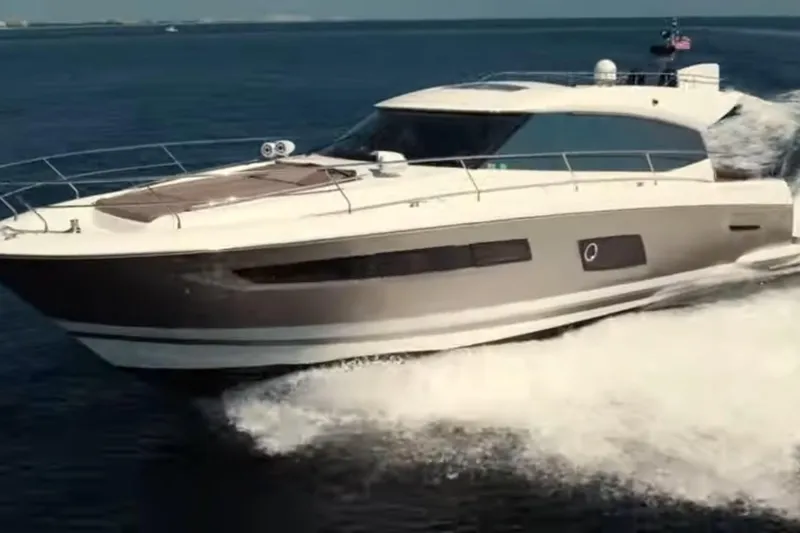 The Image of 2013 Prestige 550 S yacht cruising on open water, showcasing sleek design and luxury. - 0