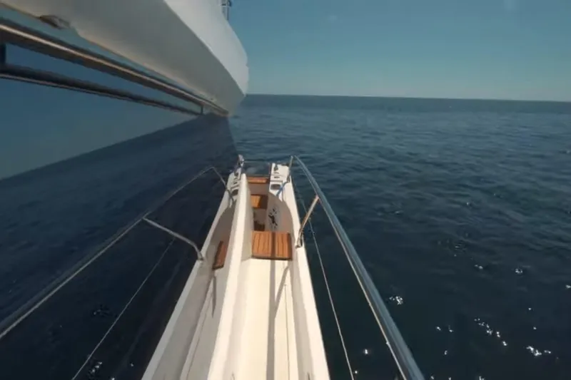 Slide: The Image of 2013 Prestige 550 S yacht cruising on open sea under clear blue sky. - 11