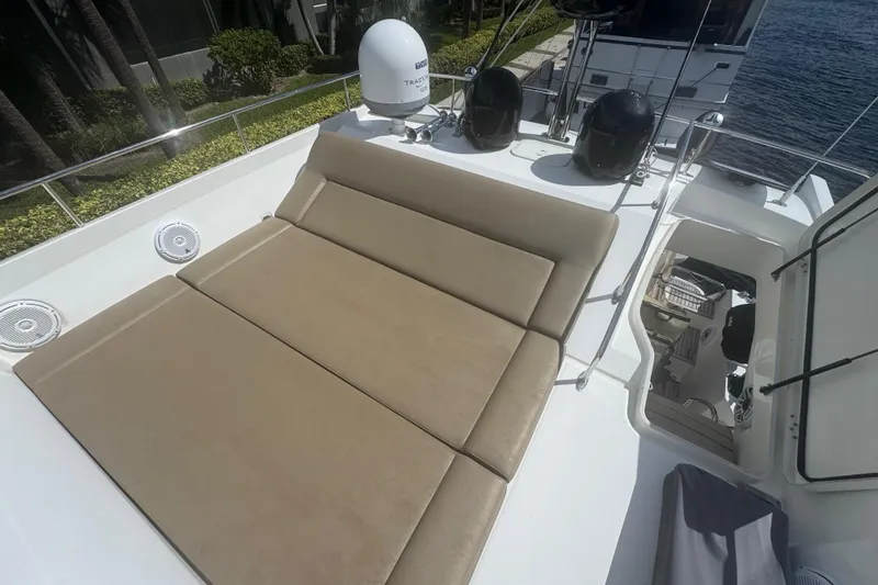 Slide: The Image of Prestige 550 S 2013 yacht deck with beige sunbed and speakers. - 17
