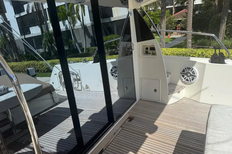 Slide: The Image of Prestige 550 S yacht deck, 2013 model, featuring sleek design and modern amenities. - 19