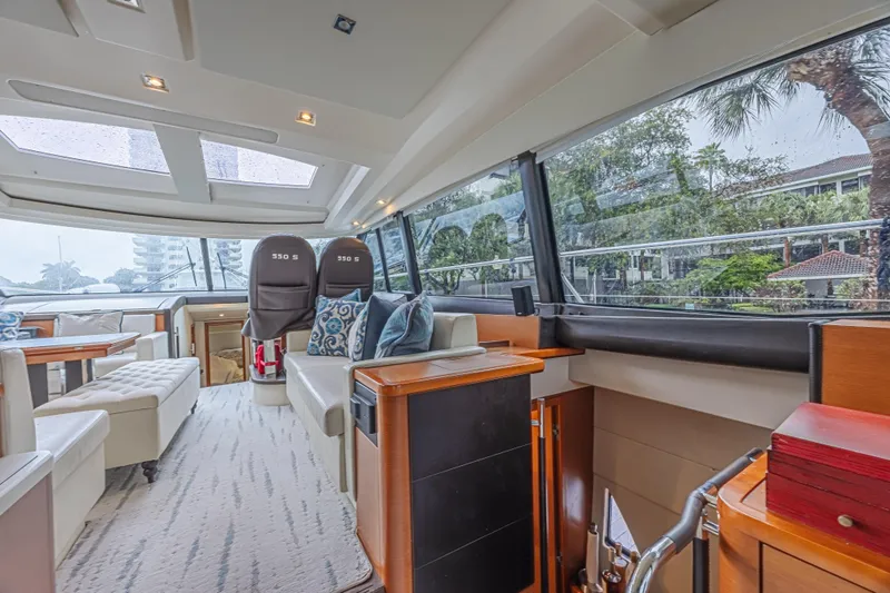 Slide: The Image of Luxurious interior of 2013 Prestige 550 S yacht with modern seating and panoramic windows. - 24