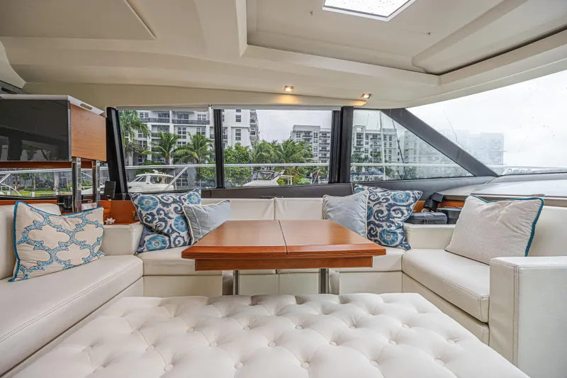 Slide: The Image of Luxurious interior of 2013 Prestige 550 S yacht with elegant seating and decorative pillows. - 27