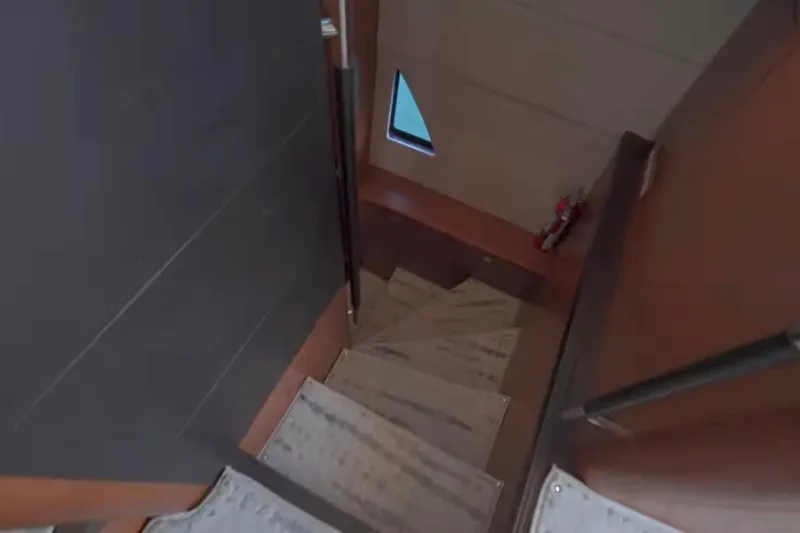 Slide: The Image of Staircase inside 2013 Prestige 550 S yacht, featuring wooden steps and modern design. - 31