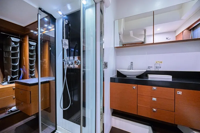Slide: The Image of Luxurious bathroom interior of 2013 Prestige 550 S yacht with modern fixtures and wood cabinetry. - 36