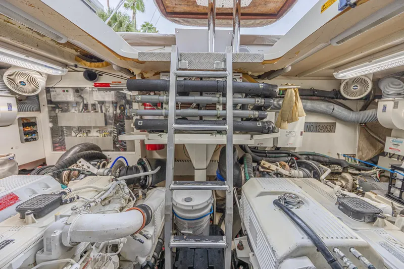 Slide: The Image of Engine room of 2013 Prestige 550 S yacht with visible machinery and equipment. - 48