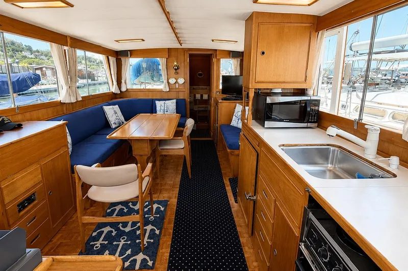 Slide: The Image of Interior of 1989 Grand Banks 42 Classic yacht with kitchen and dining area. - 27