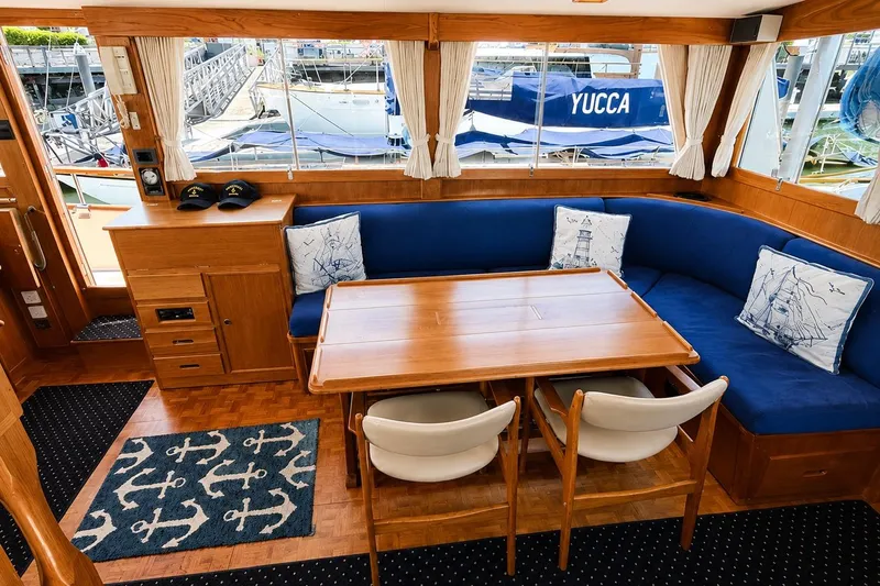 Slide: The Image of Interior of 1989 Grand Banks 42 Classic yacht with blue seating and nautical decor. - 31
