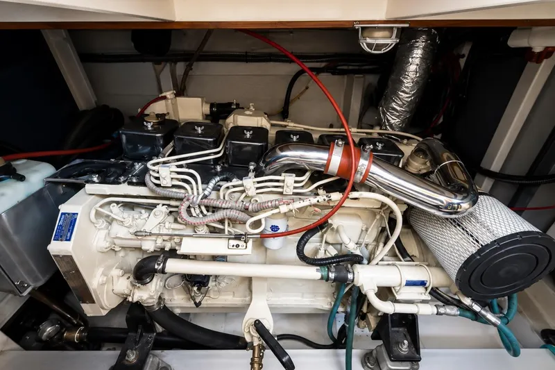 Slide: The Image of Engine room of a 1989 Grand Banks 42 Classic yacht, showcasing detailed machinery. - 39