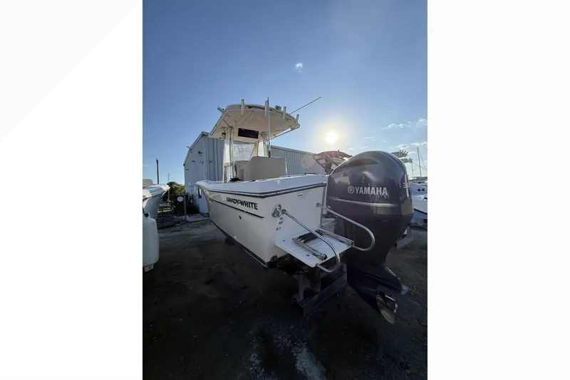 The Image of 2011 Grady-White Fisherman 230 boat with Yamaha engine, docked at sunset. - 0