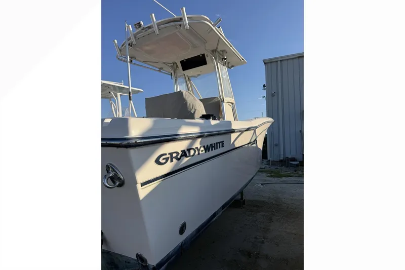 Slide: The Image of 2011 Grady-White Fisherman 230 boat docked, showcasing sleek design and sturdy build. - 3