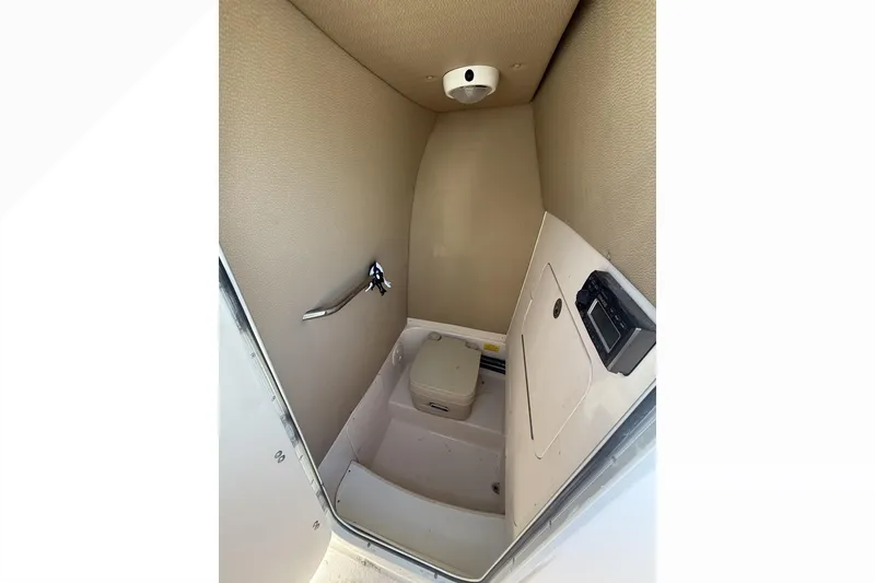 Slide: The Image of 2011 Grady-White Fisherman 230 boat interior with compact marine toilet. - 6