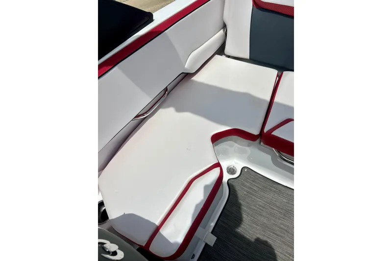 Slide: The Image of Interior seating of 2021 Scarab 195 ID boat with red and white upholstery. - 30