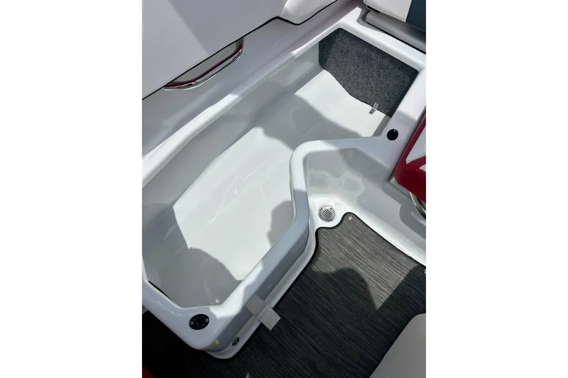 Slide: The Image of Interior storage compartment of 2021 Scarab 195 ID boat, featuring sleek design and ample space. - 31