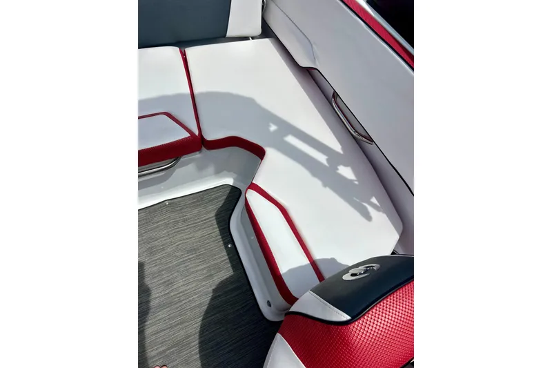 Slide: The Image of Interior seating of 2021 Scarab 195 ID boat with red and white upholstery. - 32